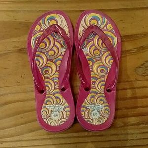Pink, yellow, and blue flip-flops sandals.